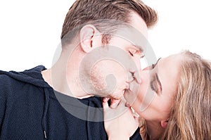 Handsome couple kissing and being affective close-up