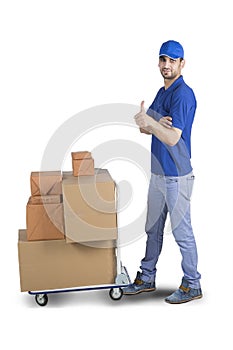 Handsome courier showing thumb up with cardboard