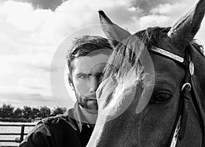 Handsome cowboy, horse rider on saddle, horseback adn boots