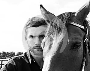 Handsome cowboy, horse rider on saddle, horseback adn boots