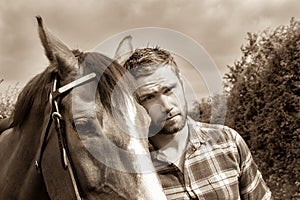 Handsome cowboy, horse rider on saddle, horseback adn boots