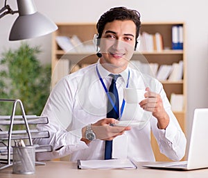 Handsome customer service clerk with headset