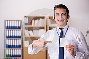 The handsome customer service clerk with headset