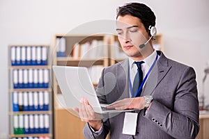 The handsome customer service clerk with headset