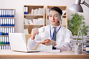 The handsome customer service clerk with headset