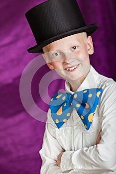 Handsome dapper young boy in a top hat