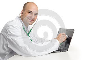 Handsome doktor with laptop photo