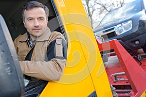 Handsome driver near modern truck