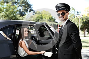 Handsome driver opening car door