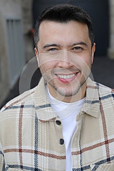 Handsome ehtnic man posing with style