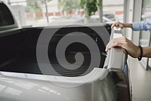 Handsome and elegant man in a car salon