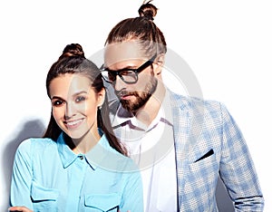 Handsome elegant man in glasses in suit with beautiful woman in colorful dress