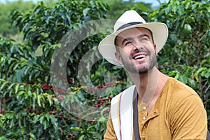Handsome farmer in coffee plantation