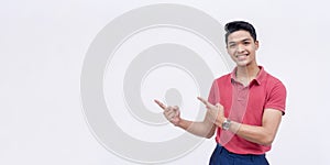 A handsome Filipino man points to the left endorsing a product or service. Copy space on the left. Isolated on a white background photo