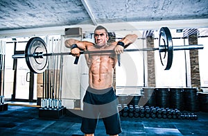 Handsome fitness man lifting barbell