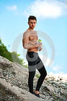 Handsome Fitness Man With Muscular Body Outdoors In Summer.
