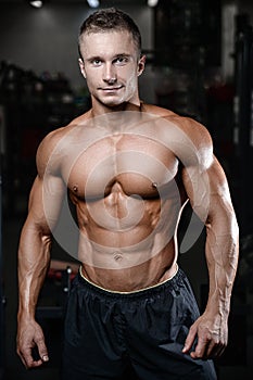 Handsome fitness model train in the gym gain muscle