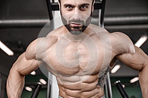 Handsome fitness model train in the gym gain muscle