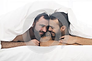 A Handsome gay men couple on bed together