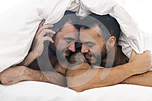 A Handsome gay men couple on bed together