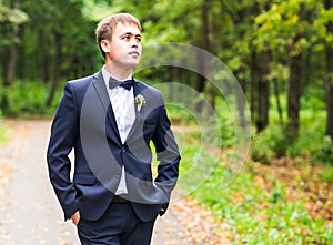 Handsome groom at wedding tuxedo.