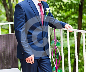 Handsome groom at wedding waiting for bride