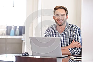 Handsome groomed caucasian accountant smiling while looking at camera