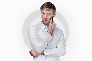 handsome guy blond in a light shirt on a white background cropped view