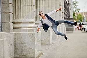 Handsome guy bounces with joy photo