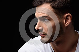 Handsome guy looking at nine o'clock