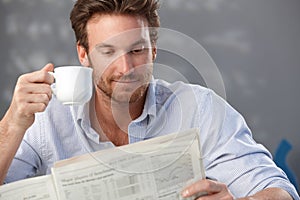 Handsome guy with newspaper