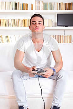 Handsome guy playing video game