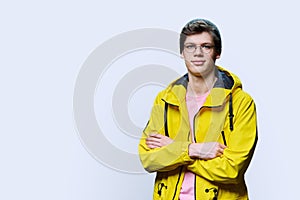 Handsome guy posing in outwear, on white background