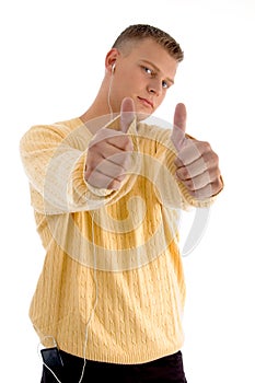 Handsome guy showing thumbs up with both hands