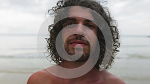 Handsome guy smilling outdoors close up portrait