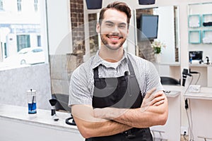 Handsome hair stylist smiling at camera