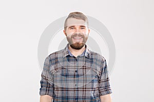 Handsome happy bearded man smiling and laughing on white background