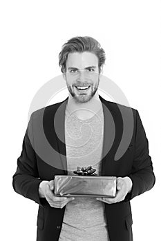 Handsome happy businessman holding blue gift box