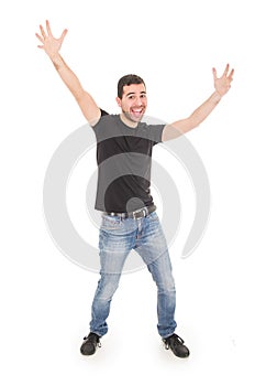 Handsome happy guy posing with arms up