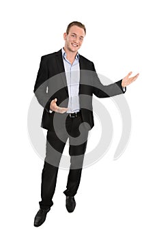 Handsome happy isolated young businessman presenting with hands.