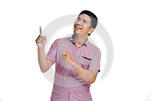 Handsome of happy smiling asian man pointing of a copyspace