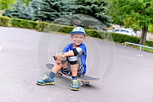 Handsome happy young boy on his skateboard