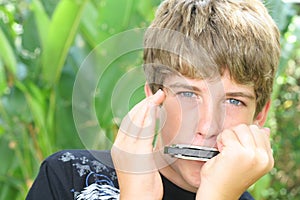 Handsome harmonica boy