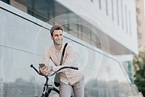 Handsome hipster browses net during coffee break