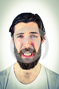 Handsome hipster crying at camera