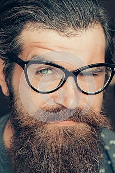 Handsome hipster winks his eye