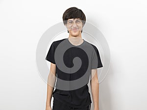 Handsome hipster young boy wearing casual shirt making funny face