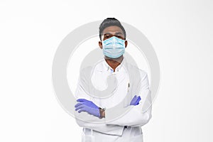 Handsome Indian Male Doctor with surgical or safety health Mask on. standing isolated over white background