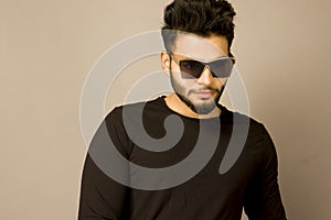 Handsome Indian Male Model in black tshirt and denims