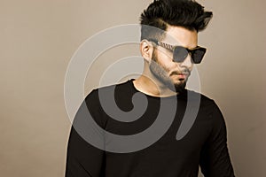 Handsome Indian Male Model in black tshirt and denims
